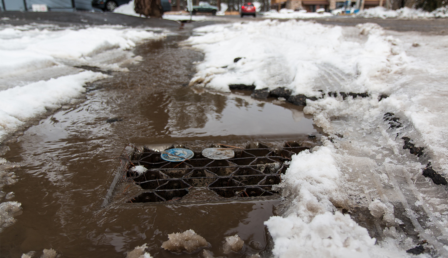 Polluted water running down a storm drain.