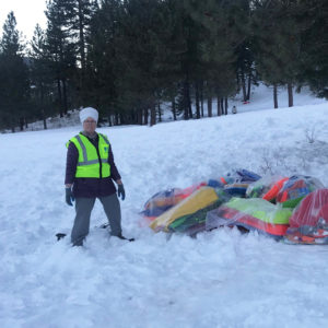 A Tahoe Blue Crew leader and the sled litter she gathered