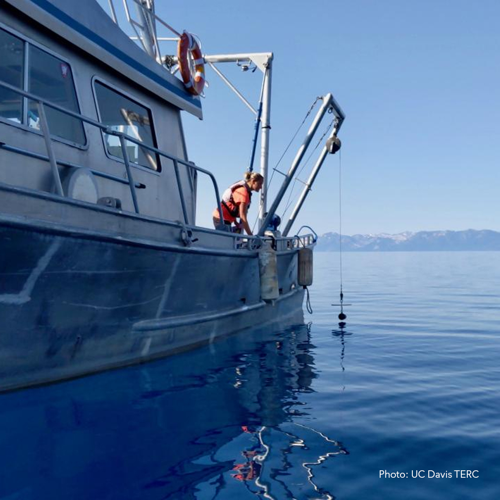 A UC Davis researcher prepares to take a lake clarity measurement