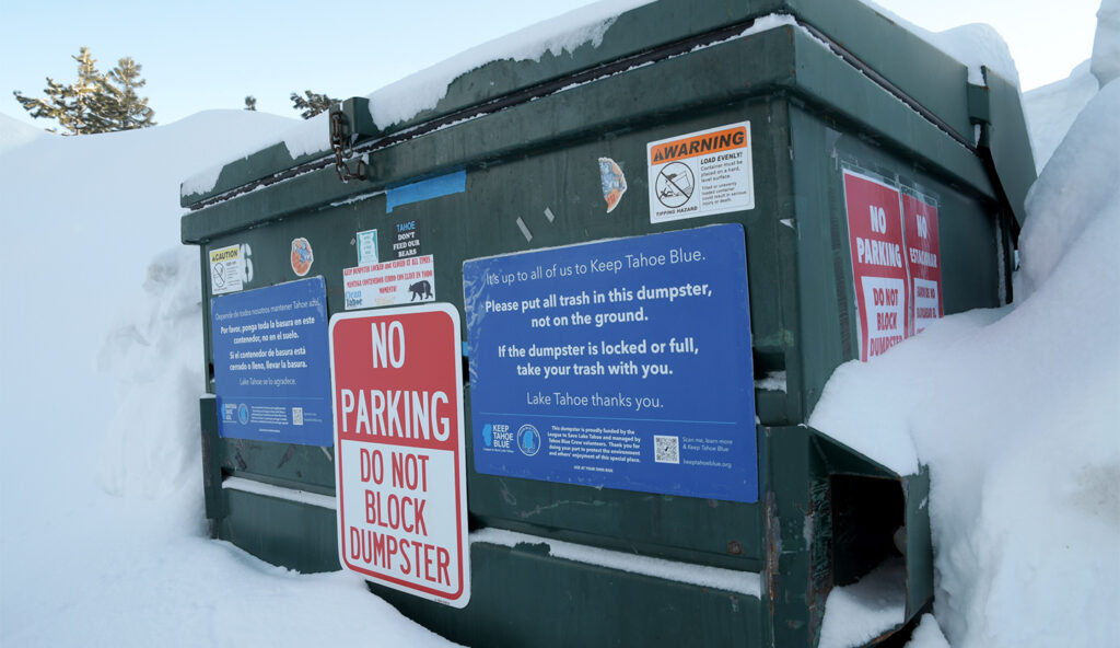 Close up of signs on a dumpster