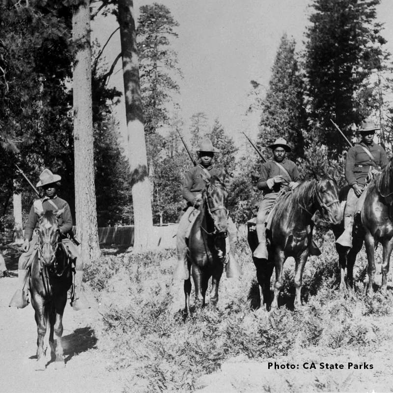 Cavalry riders pose for a balck and white photograph