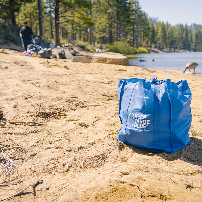 A bag full of litter sits on of of the beaches cleaned up by League volunteers on July 5, 2023.