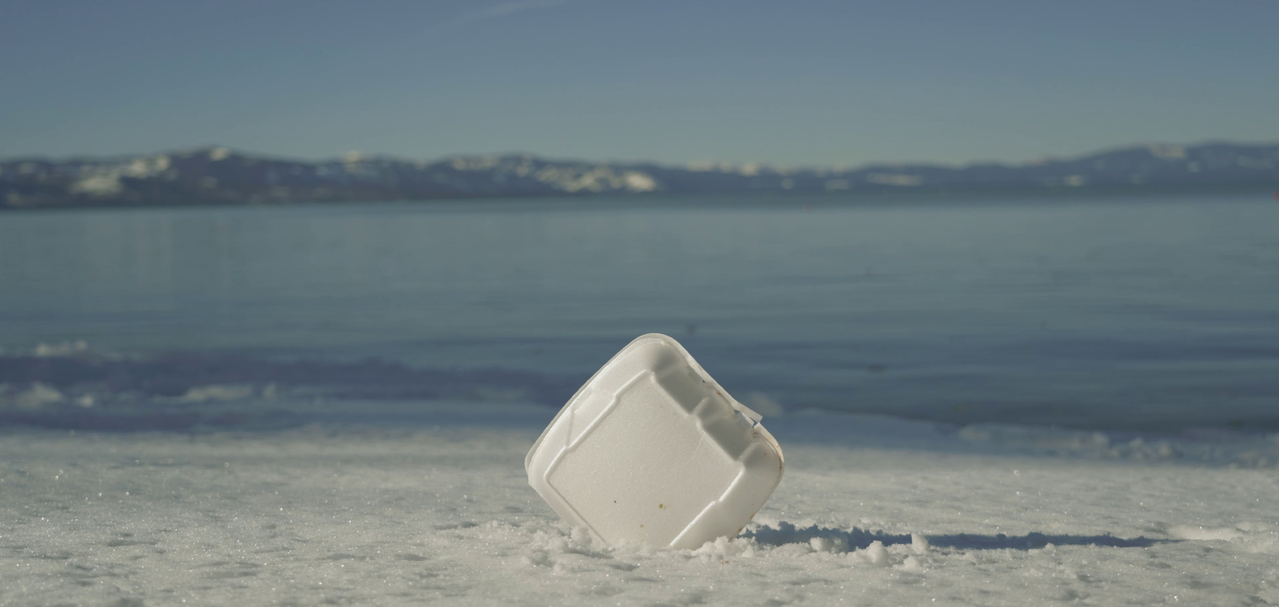 Styrofoam on snowy shore