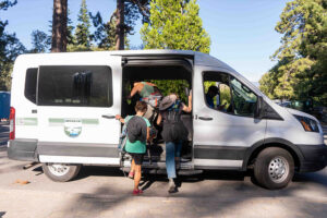 Emerald Bay shuttle riders catch a ride.