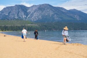 volunteers cleaning up tahoe beach, keep tahoe blue